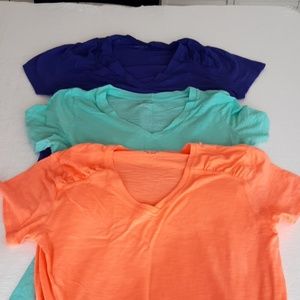 Three exercise shirts size Large